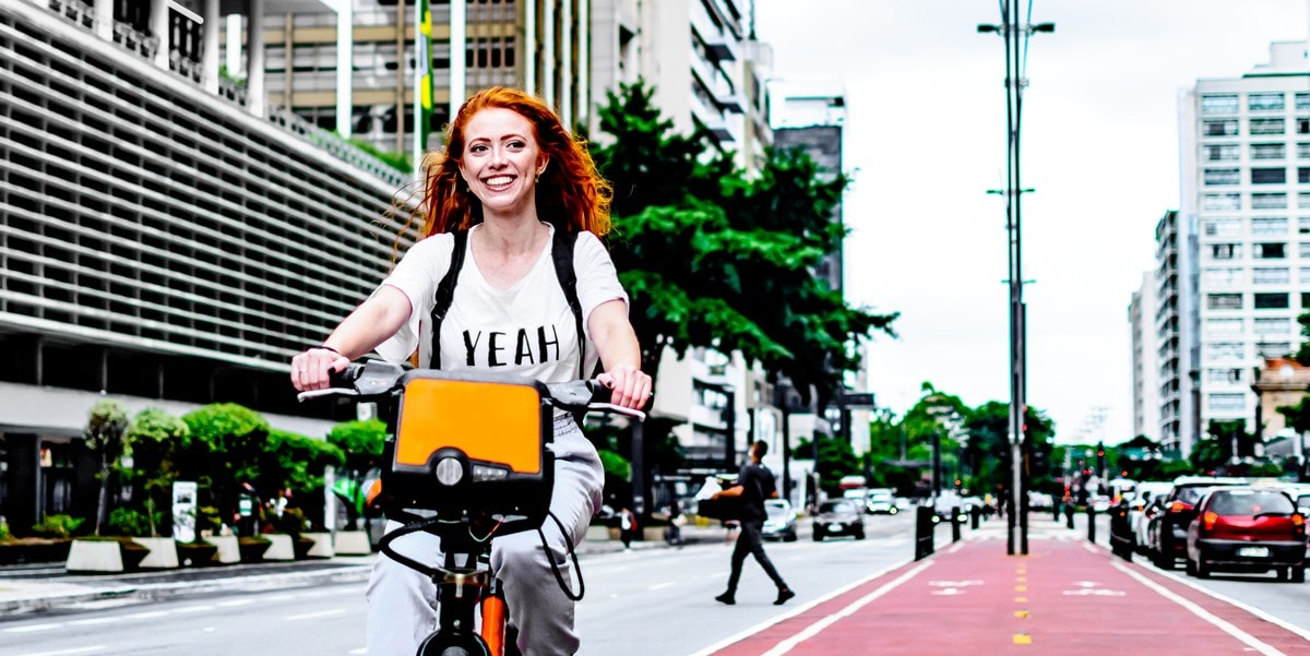 young woman riding bicycle in the city