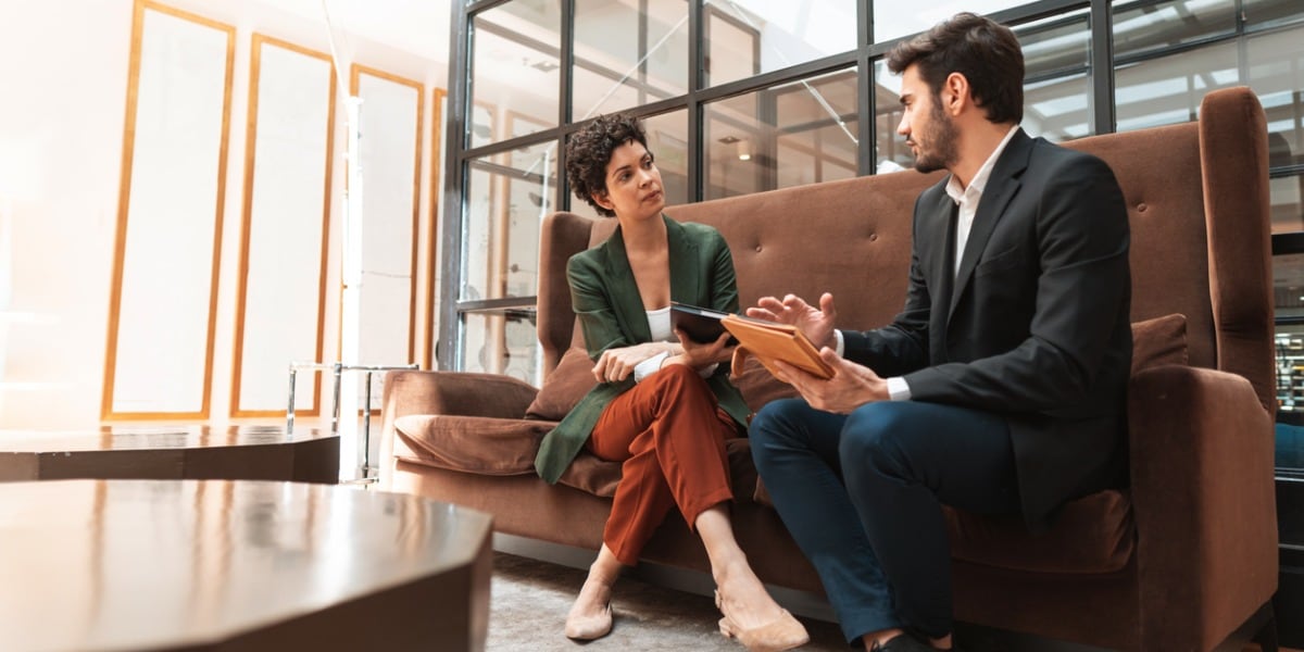 two people collaborating in an office setting